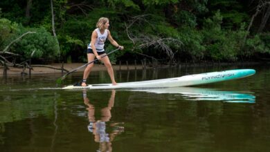 How do you get on a paddleboard for the first time?