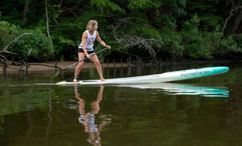 How do you get on a paddleboard for the first time?