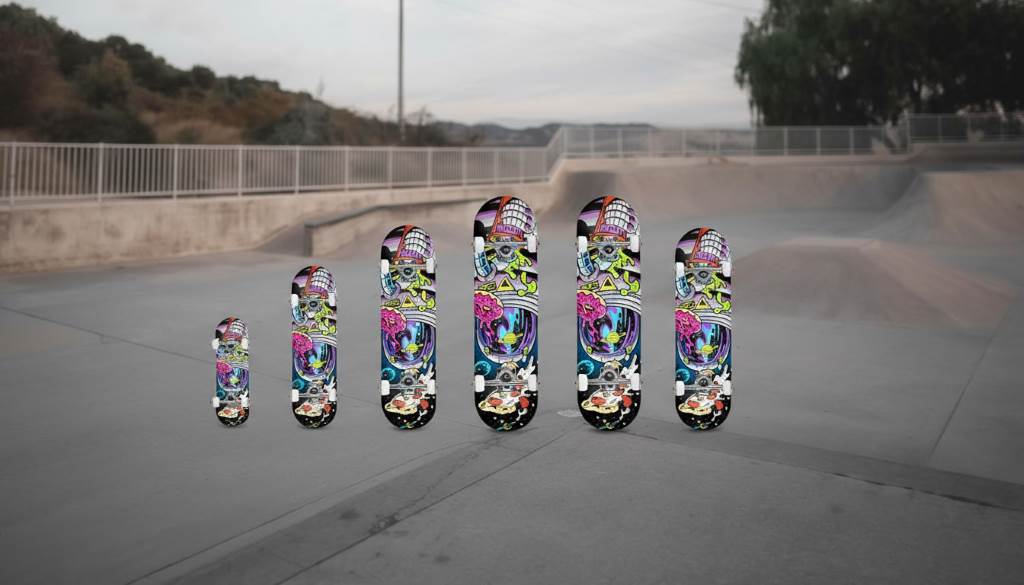 Group of various sized beginner skateboards lined up showing wheels, trucks, and vibrant designs for children