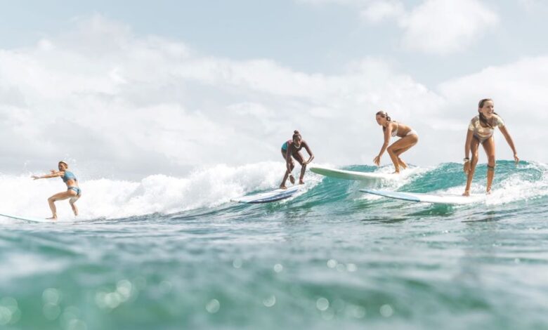 Athlete doing surf training workout on beach in California for faster fitness results