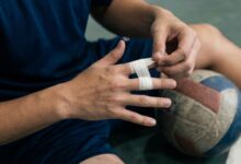 Volleyball player taping fingers before a match